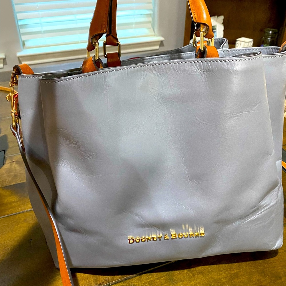 Dooney and Bourke bag. Dove gray/brown handles.